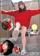 A woman in a red sweater is posing for a magazine.