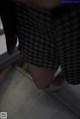 A close up of a person's legs on an escalator.